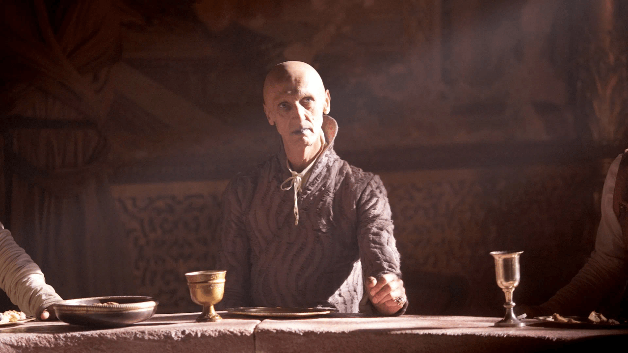 Game of Thrones S2E7 "A Man Without Honor" episode guide image of a lone armored man kneeling in a snowy forest beside a fallen sword