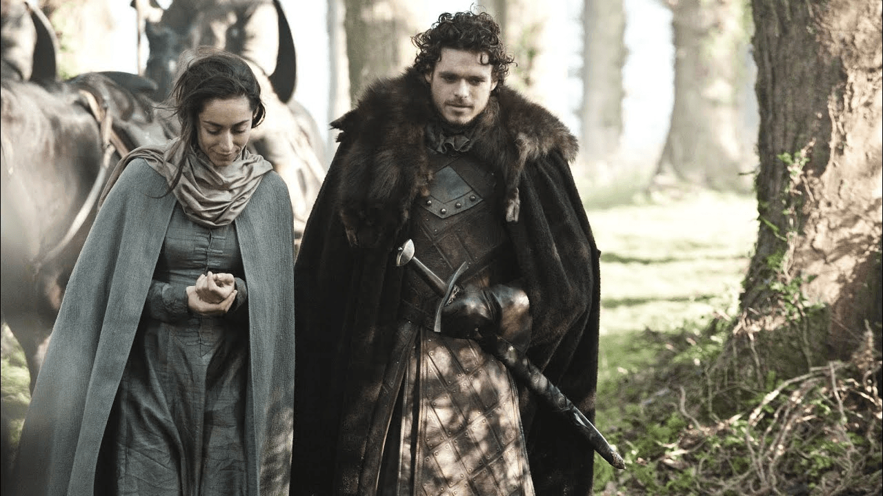 Game of Thrones S2E8 "The Prince of Winterfell" episode guide showing a snowbound castle wall above a tense camp with torches in the mist.